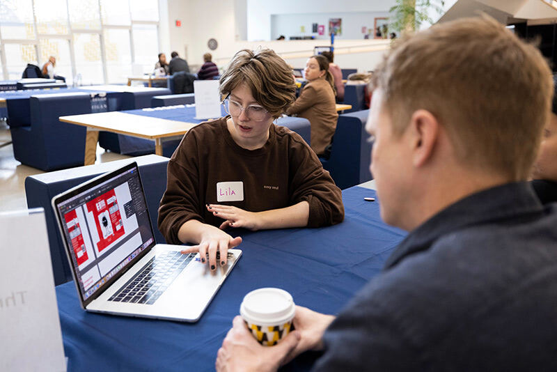 a student gets advice at Portfolio Expo